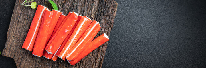 crab stick surimi seafood crab meat semi-finished meal snack on the table copy space food background rustic  © Alesia Berlezova