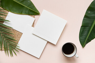 Styled summer wedding desktop stationery mockup. Blank greeting and invitation card. Green tropical leaves with empty space.