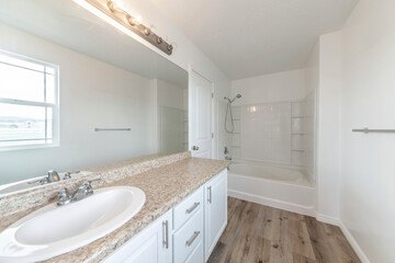 Traditional bathroom interior with vanity sink and shower tub combo kit