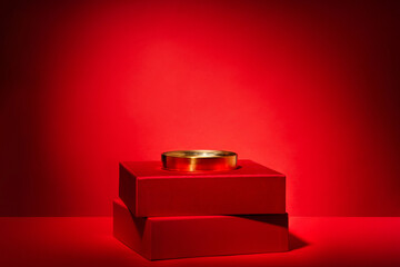 Red podium of gift boxes golden circle, decor on red background.