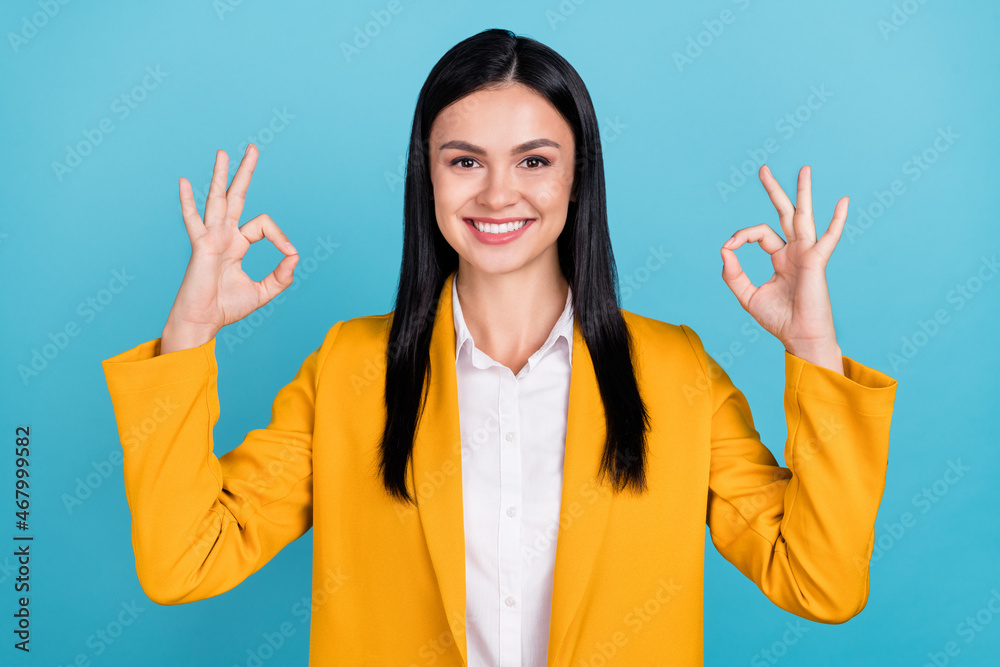 Wall mural Photo of cheerful nice pretty business lady make okay signs recommend advert isolated on blue color background