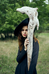 woman in witch costume halloween forest staff gothic