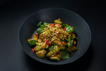 asian salad with asparagus on a black background