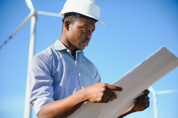 Engineers are investigating the wind turbine.