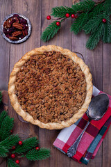 Traditional American apple cranberry pie, topped with crumbled dough and pecan, vertical, top