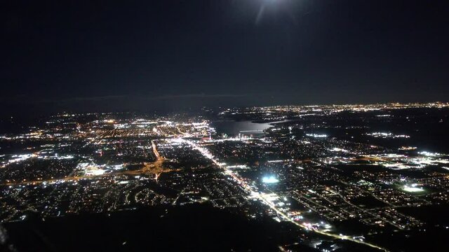 Aerial Flying Over City At Night 3000 Ft Lake Ocean In Distance Areanas Dark Night