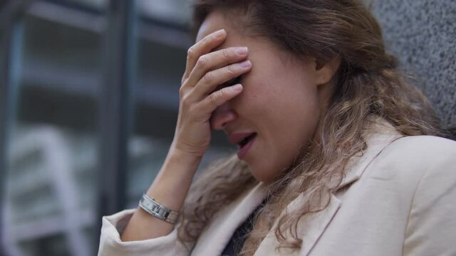 Upset woman crying hysterically suffering depression after divorce stressful job