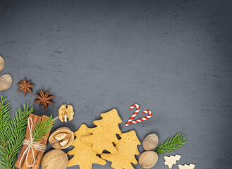 Food Christmas background with Christmas gingerbread cookies on a concrete backdrop	
