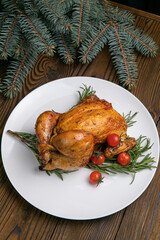 grilled chicken on a wooden table. Christmas dinner

