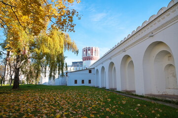 Fototapeta na wymiar Autumn in the Novodevichy Monastery. Nikolskaya Tower and Monastery Walls, Moscow, Russia