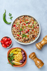 Bulgur pilaf with eggplant and vegetables. Top view with copy space