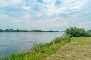 Fototapeta na wymiar The Vistula River against the cloudy sky.