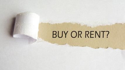 buy or rent. words. text on gray paper on torn paper background