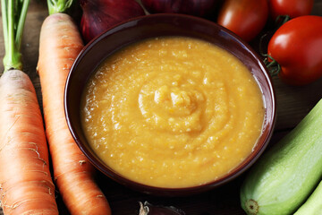 Squash caviar from zucchini, carrot, onions, spices on darkk moody rustic wooden background, closeup, homemade food in plastic free jars, sustainable living and saving leftovers concept