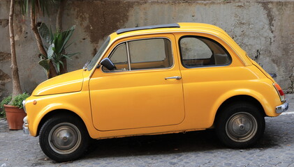 Yellow Small Vintage Car in Rome, Italy