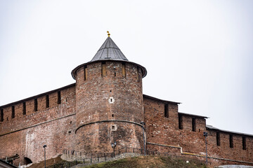 Fototapeta premium ancient unique Nizhny Novgorod Kremlin made of red stone on a cloudy autumn day