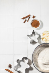 Ingredients for Christmas gingerbread with cinnamon, anise, flour on a white table
