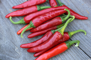 Red Cayenne Peppers on Rustic Wooden Background