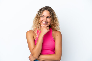 Girl with curly hair isolated on white background looking to the side and smiling
