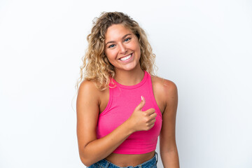 Girl with curly hair isolated on white background giving a thumbs up gesture