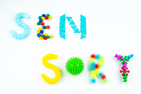 Sensory word and colorful balls that magically bunch. Sensory training, sensory integration, dysfunction and processing disorder. Sensory toy, creativity, fine motor skills, occupational therapy