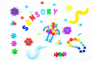 Sensory word and colorful balls that magically bunch. Sensory training, sensory integration, dysfunction and processing disorder. Sensory toy, creativity, fine motor skills, occupational therapy
