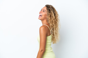Fototapeta premium Girl with curly hair isolated on white background laughing in lateral position