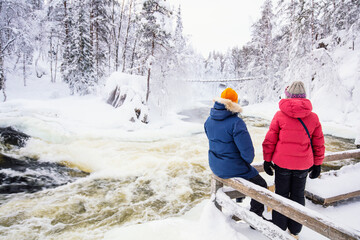 Father and daughter enjoying winter landscape