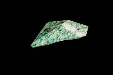 Nephrite mineral stone macro on a black background