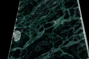 macro stone Serpentinite mineral on black background