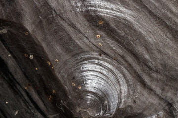 Macro stone mineral obsidian on a black background