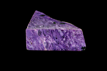 Macro stone Charoite mineral on a black background