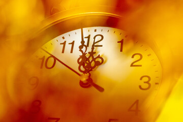 The clock in a gold frame shows the approach of the new year, 12 or 24 hours. New Year's greeting card