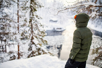 Teenager enjoying winter landscape
