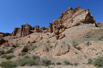Fototapeta premium Canyon sunlit view with rocks and a pronounced texture of a yellowish stone