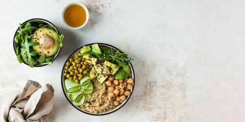 Banner healthy vegetable lunch from the Buddha bowl with quinoa, avocado, chickpeas. Copy space.