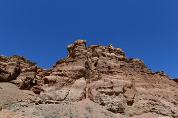 Fototapeta premium Canyon sunlit view with rocks and a pronounced texture of a yellowish stone