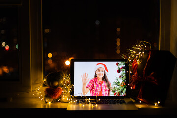making video call on social network with family and friends on Christmas day.