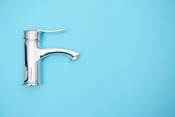 New chrome or steel mixer tap for bathroom sinks