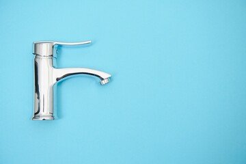New chrome or steel mixer tap for bathroom sinks