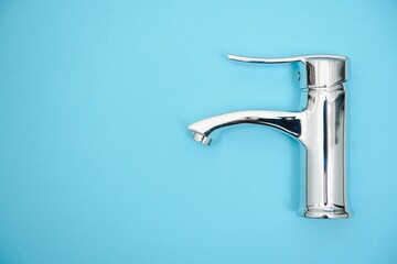New chrome or steel mixer tap for bathroom sinks