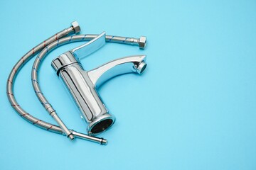 New chrome or steel mixer tap for bathroom sinks