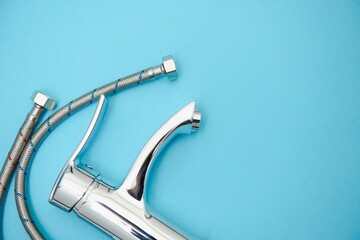 New chrome or steel mixer tap for bathroom sinks