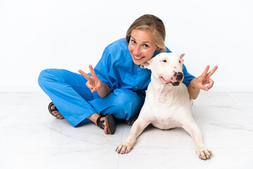 Young veterinarian English woman with dog