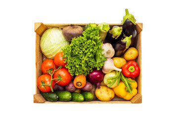 Fresh vegetables in a wooden box isolated on a white background. Eco lifestyle