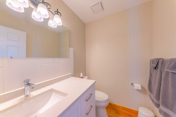 Obraz na płótnie Canvas Small bathroom interior with white tile backsplash on the vanity sink