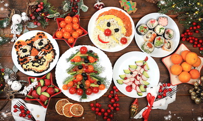 Christmas new year dishes, traditional festive salad with tiger and santa claus, symbol of the year, edible veggie trees made of vegetables and fruits, food design idea, fir branches and decorations ,