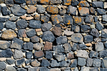 Stone wall. Rock stone texture. Blocks are bricks.