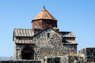 Church. Armenia. An ancient monastery. Building with a dome. Against the background of the sky.