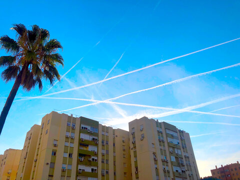 Strange lines of chemtrails in the city sky